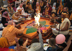Members of the Hare Krishna congregation take part in a holy Hindu ritual called Yajna at the Bhaktivedanta Manor Krishna temple (PA)